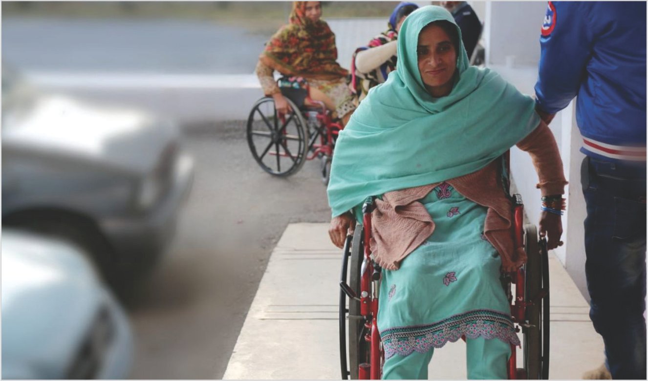 Slider Picture 1 - Women Using Wheelchair